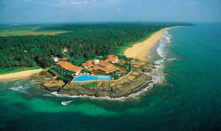 The wide golden beach and river mouth at Bentota